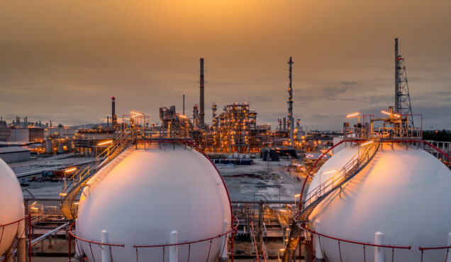 Gas storage sphere tank in petrochemical industry zone with oil and gas refinery factory plant petrochemical industry and oil storage tank background, Oil refinery at twilight.