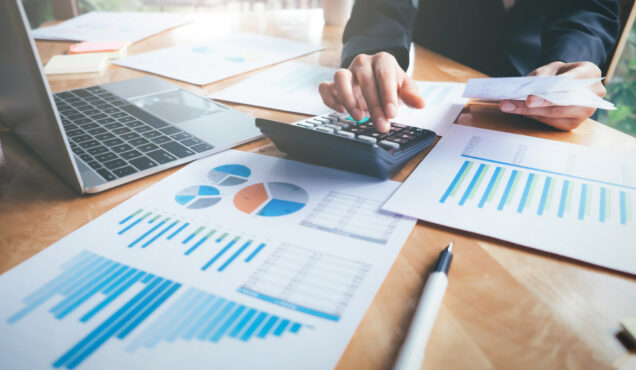 Finances Saving Economy concept. Female accountant or banker use calculator.